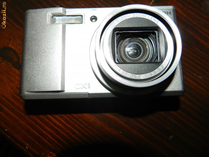 Camera foto ricoh CX1 (obiectiv defect)+incarcator+acumulator foto mare